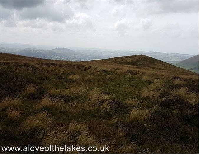 Heading towards the higher summit cairn