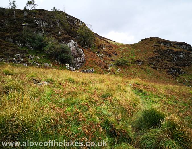 The path heads towards a small Col