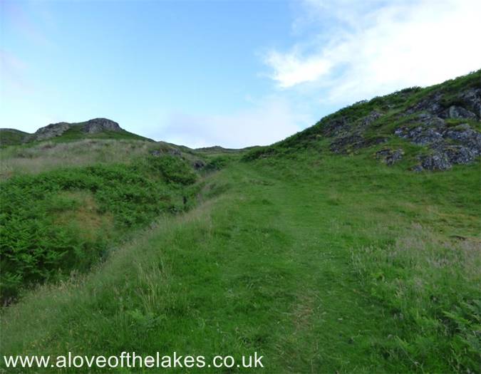 The path runs through an area of bracken