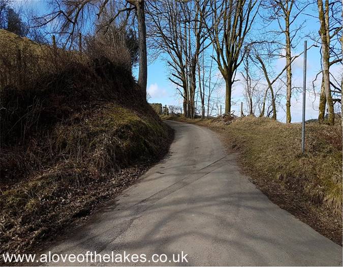 The path leads to a gate