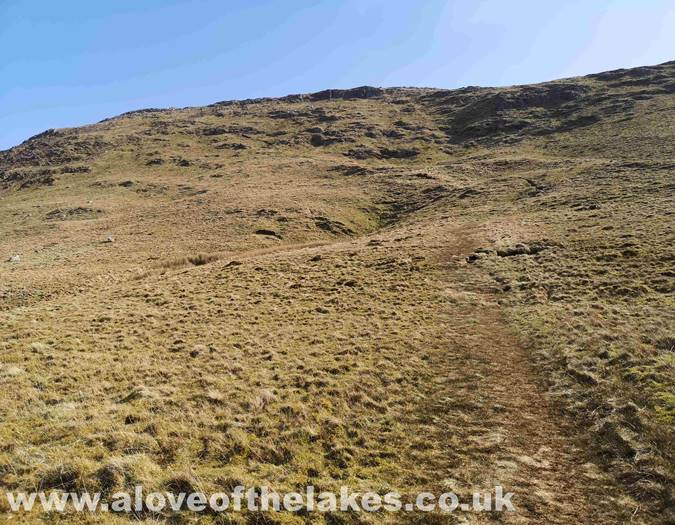 The path climbs up to the ridge line