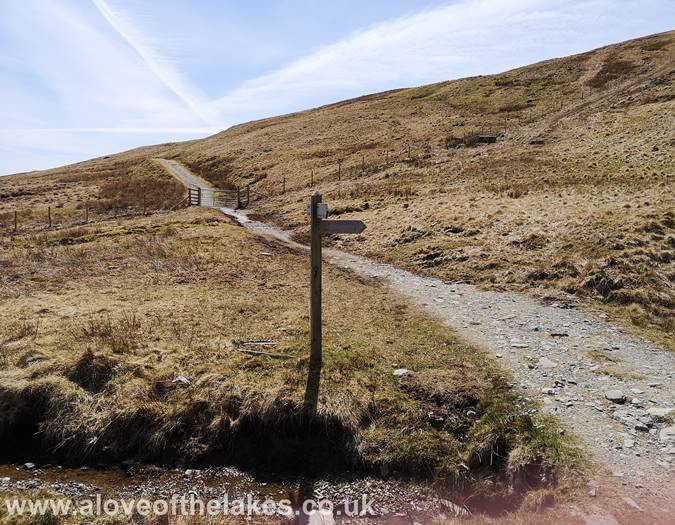 The Nan Bield Pass sign post